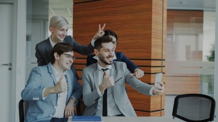 free-it-ticket-templates-featured Colleagues taking a selfie in the office