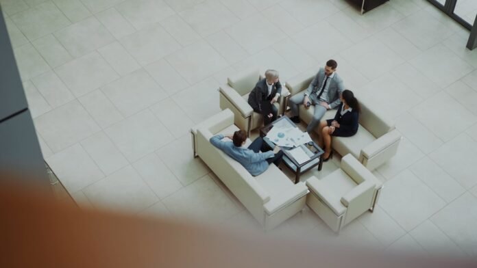 gartner-market-guide-itsm-featured Business people meeting in a modern office lobby
