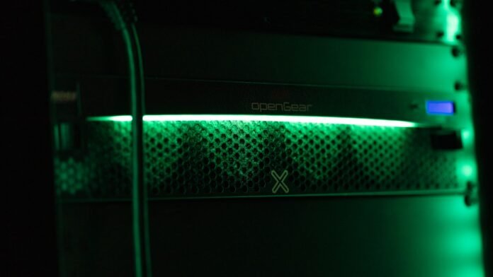 it-asset-management-vs-service-management-featured a close up of a green light in a server