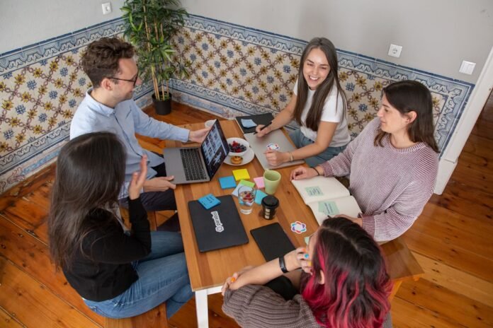 incident-management-statistics-and-benchmarks-featured a group of people sitting around a wooden table