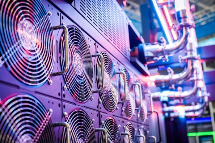 it-inventory-management-software-compared-featured Close-up of server cooling fans in a vibrant data center.