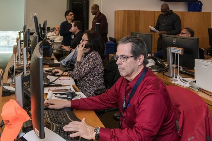 knowledge-base-automation-with-ai-featured man in red jacket sitting beside woman in black and white long sleeve shirt